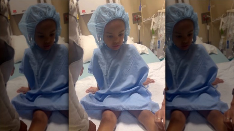 Egypt Sherrod and Mike Jackson's daughter sits in a hospital bed