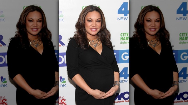 Egypt Sherrod cradles her baby bump in December 2011