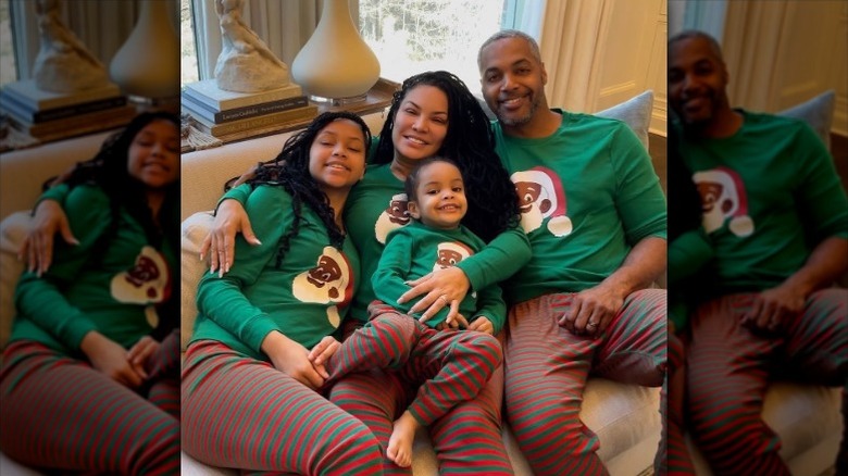 Egypt Sherrod and Mike Jackson pose with their daughters in Christmas sweaters