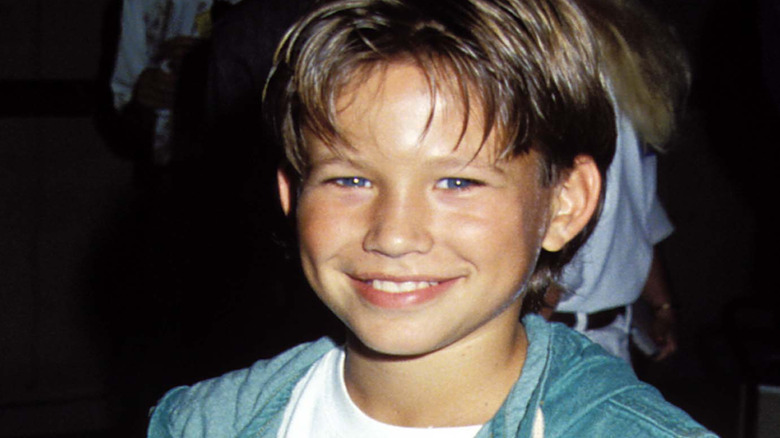 Jonathan Taylor Thomas posing for cameras