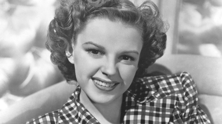 Judy Garland poses for a portrait in a checkered outfit