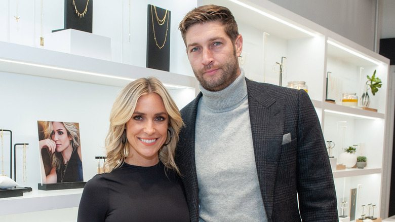 Kristin Cavallari and Jay Cutler pose indoors