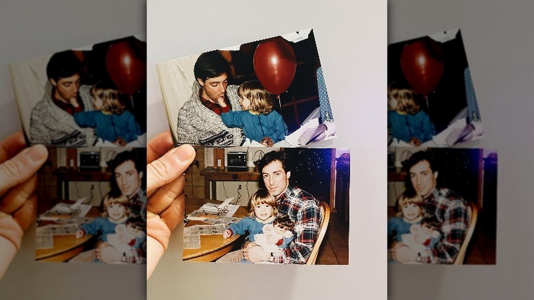 Kristin Cavallari holds two pictures of her sitting in her father's lap as a child