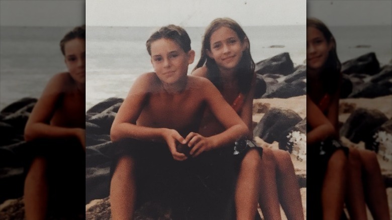 Young Kristin Cavallari poses with brother Michael at the beach