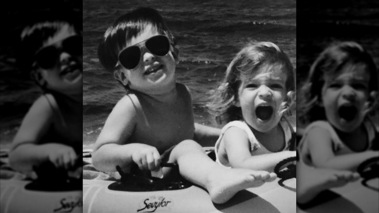 Kristin Cavallari and her brother Michael playing in the water as children