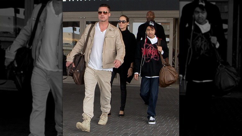 Brad Pitt, Angelina Jolie, and Maddox Jolie-Pitt leaving the airport