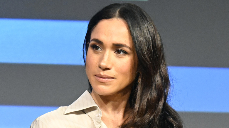 Meghan Markle listens during an event