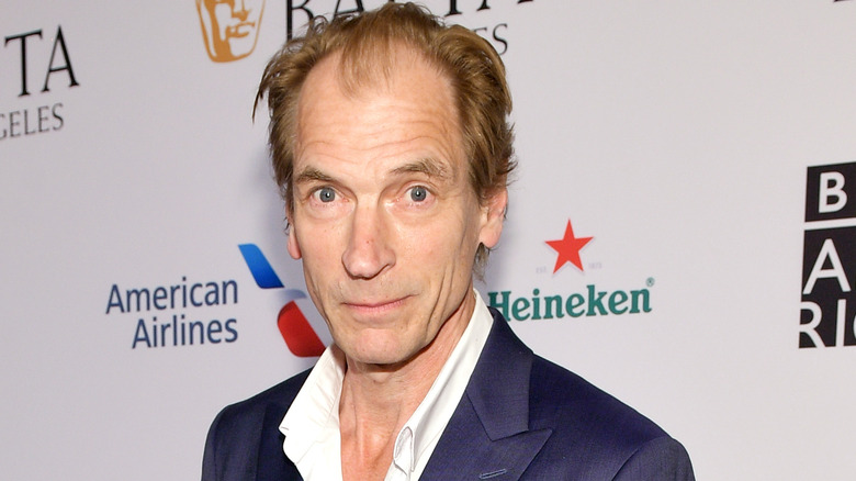 Julian Sands posing