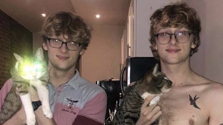 Adam and Patrick Perkins posing with cats