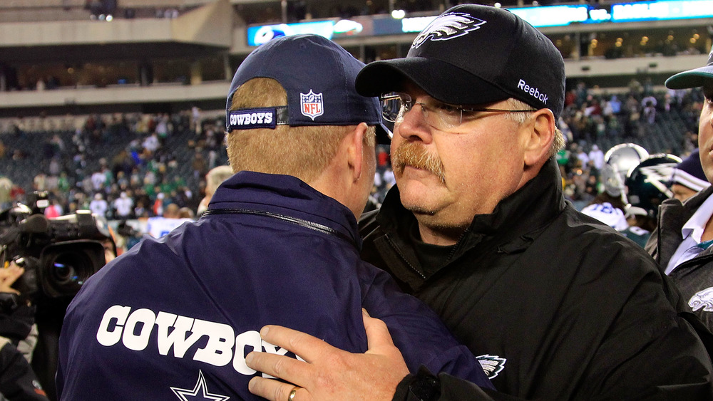 Dallas Cowboys head coach Jason Garrett embraces Andy Reid after a 2011 game