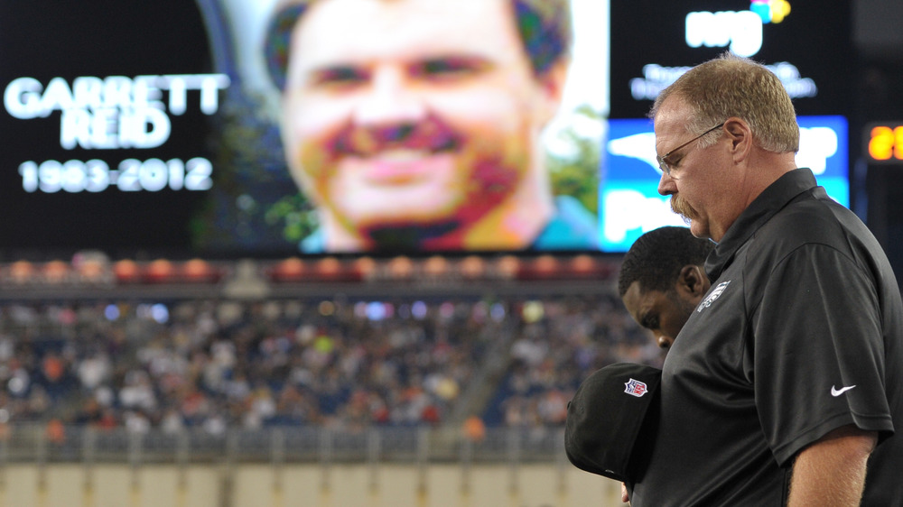 Andy Reid bows his head to honor son Garrett Reid in 2012