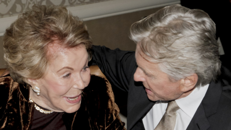 Anne Douglas and Michael Douglas talking