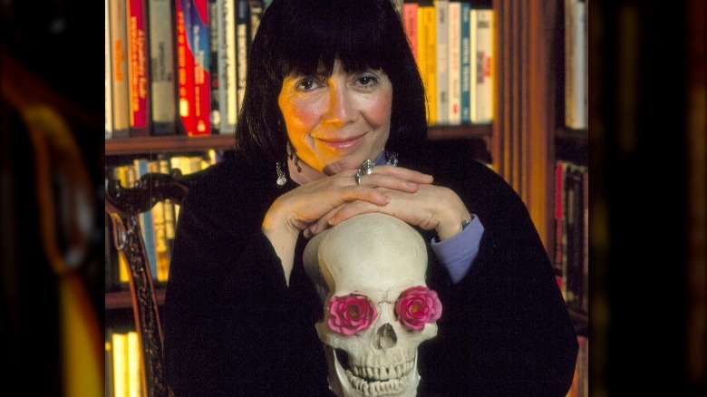 Anne Rice poses with a skull 