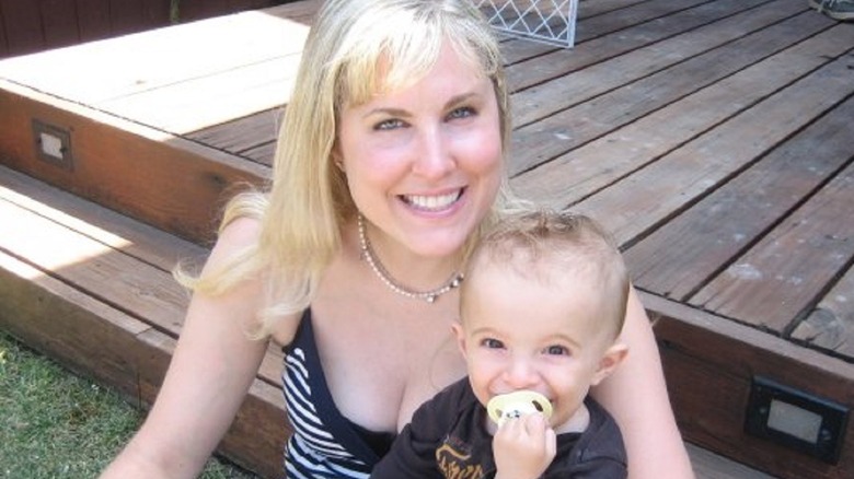 Heidi Ferrer holding a baby