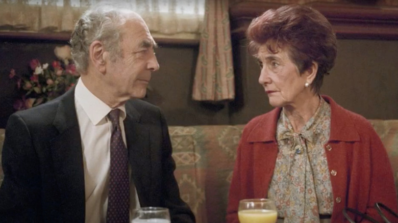 Leonard Fenton and June Brown facing one another with serious expressions