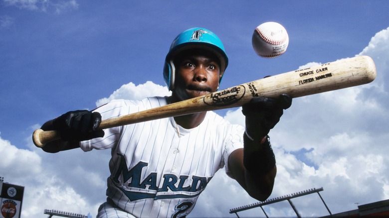 Chuck Carr posing with baseball bat