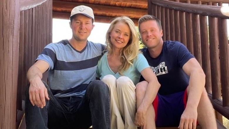 Harrison Wagner smiles with his brother and mother