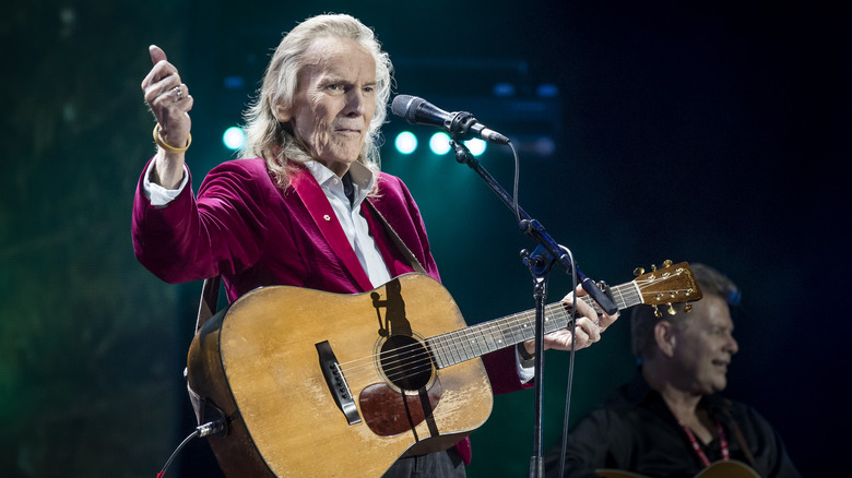 Gordon Lightfoot on stage with guitar