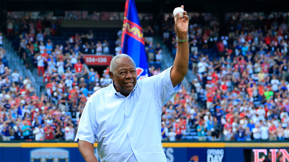 Hank Aaron throws a ceremonial baseball pitch