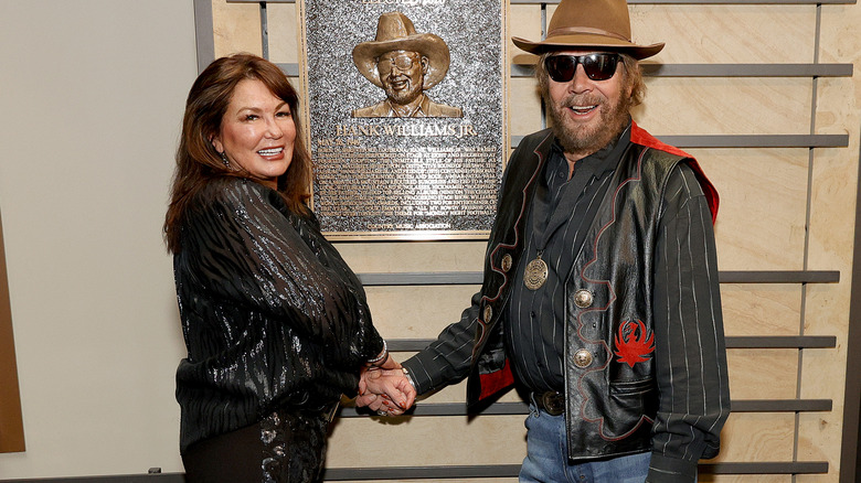 Mary Jane Thomas, Hank Williams Jr. holding hands