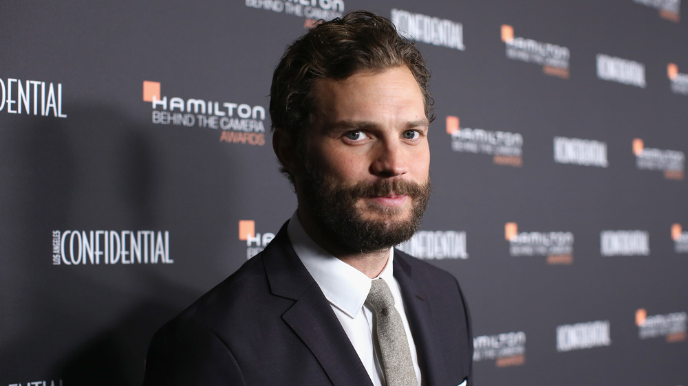 Jamie Dornan posing on the red carpet