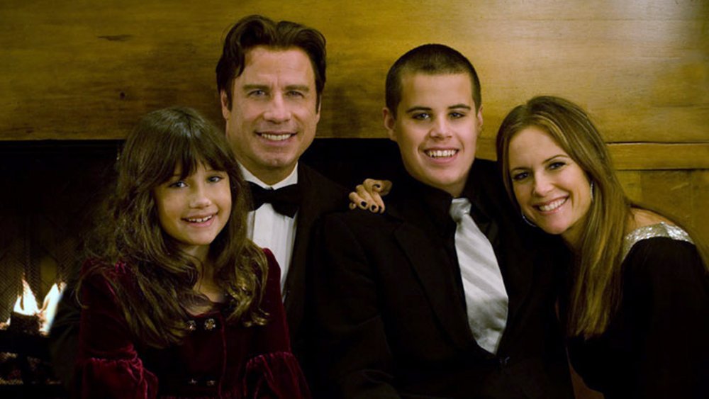 John Travolta (2nd L), his wife Kelly Preston (R) and their children Jett (2nd R) and Ella pose in this undated picture