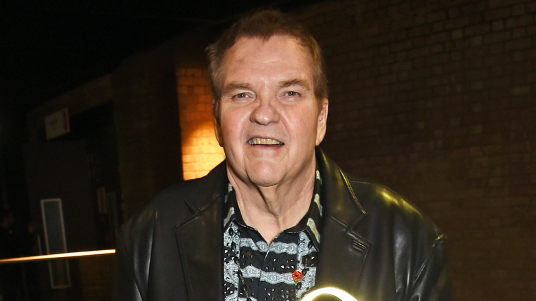 Meat Loaf posing with an award