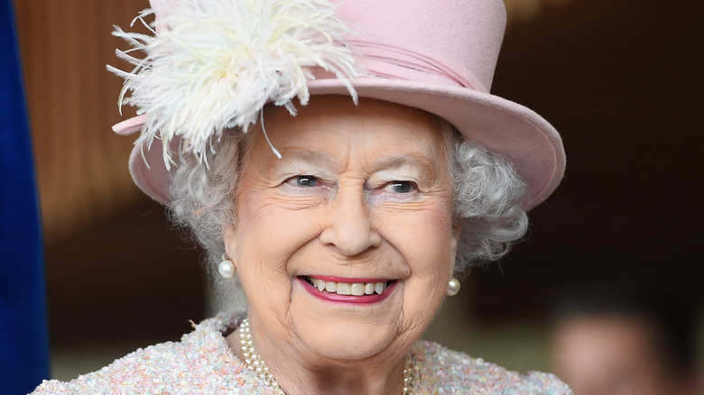 Queen Elizabeth in pink hat, pink outfit