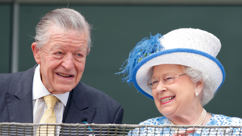 Sir Michael Oswald and Queen Elizabeth laughing 