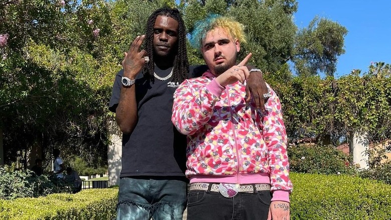 Chief Keef with arm around Sad Frosty