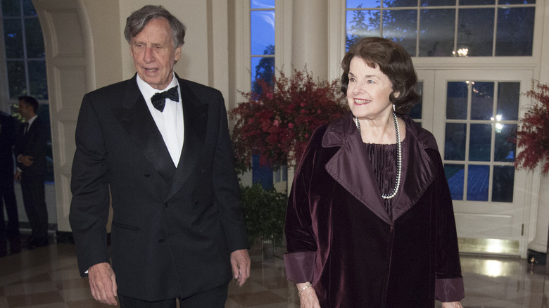 Richard Blum and Dianne Feinstein smiling at an event