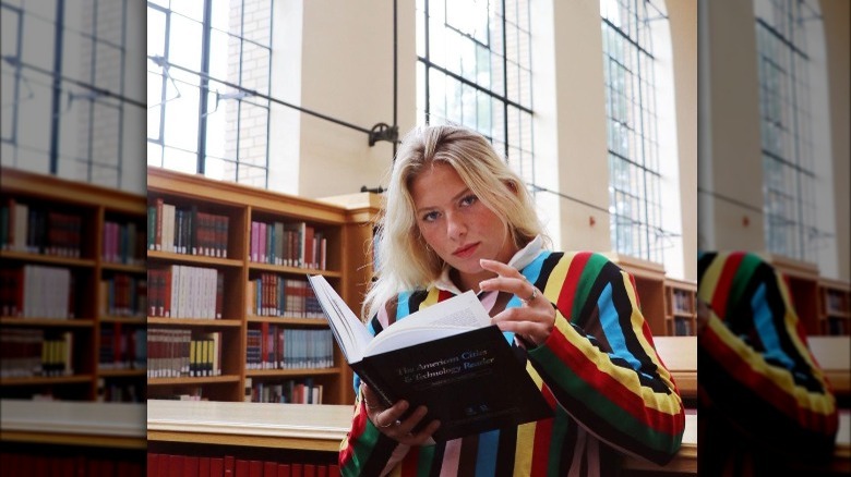 Katie Meyer reading a book at Stanford