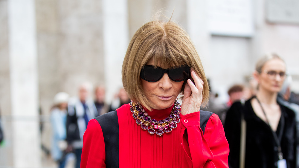 Anna Wintour walking while wearing sunglasses