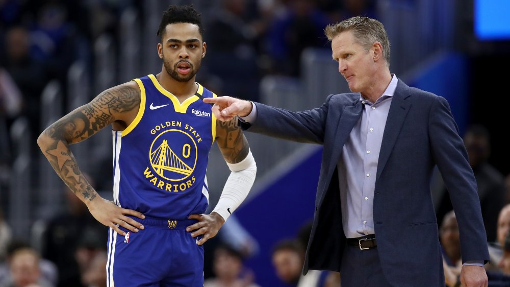 D'Angelo Russell #0 of the Golden State Warriors speaks to head coach Steve Kerr of the Golden State Warriors during their game against the Utah Jazz