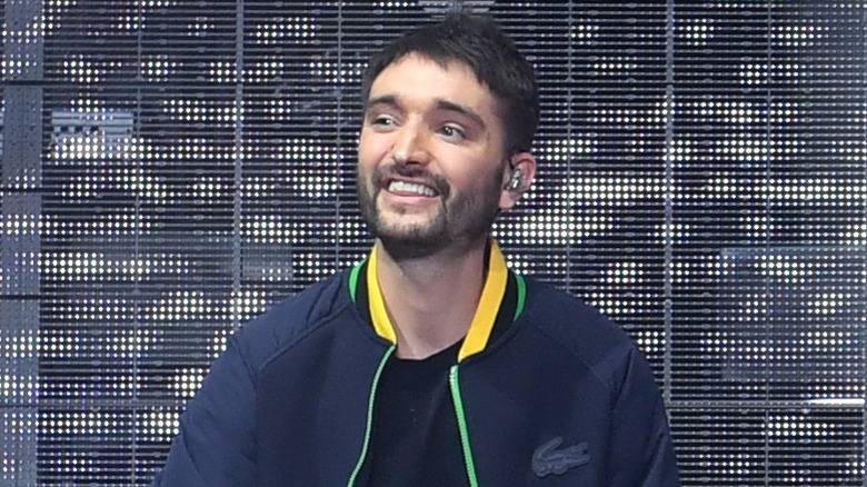 Tom Parker smiling on stage