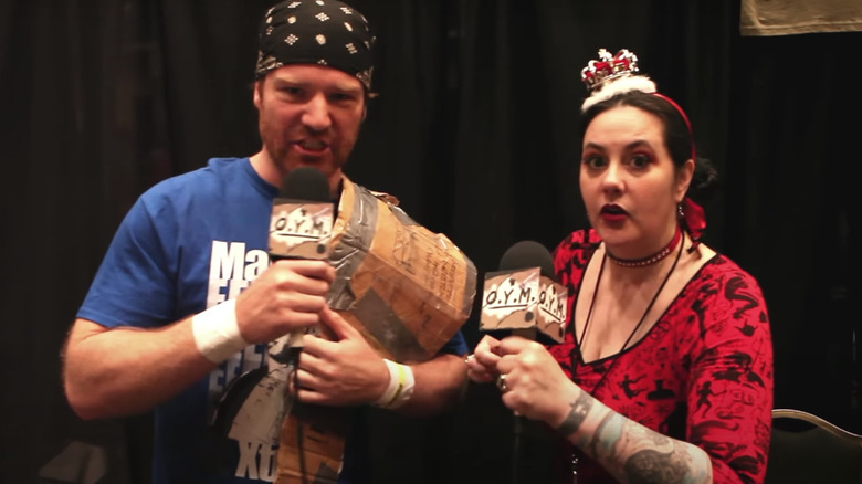 Daffney Unger holding microphone and wearing crown