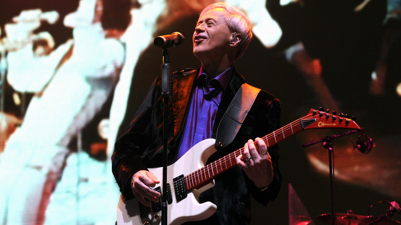 Wayne Osmond playing guitar