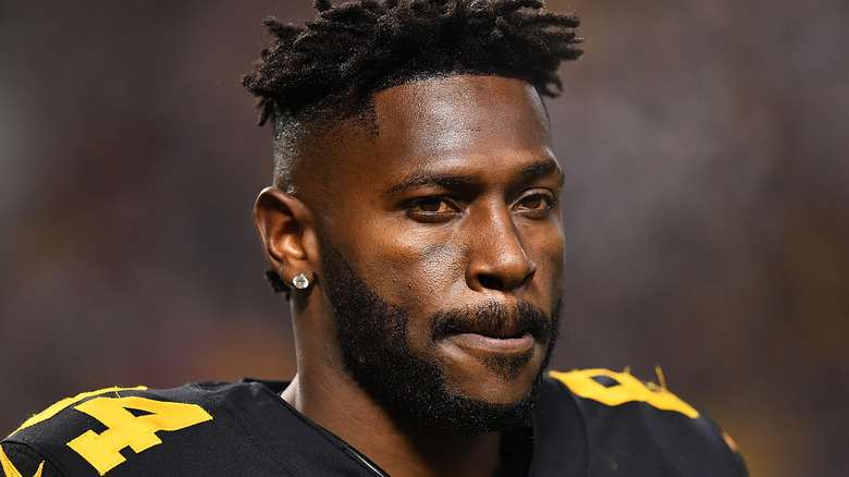 Antonio Brown wearing a black jersey on the football field