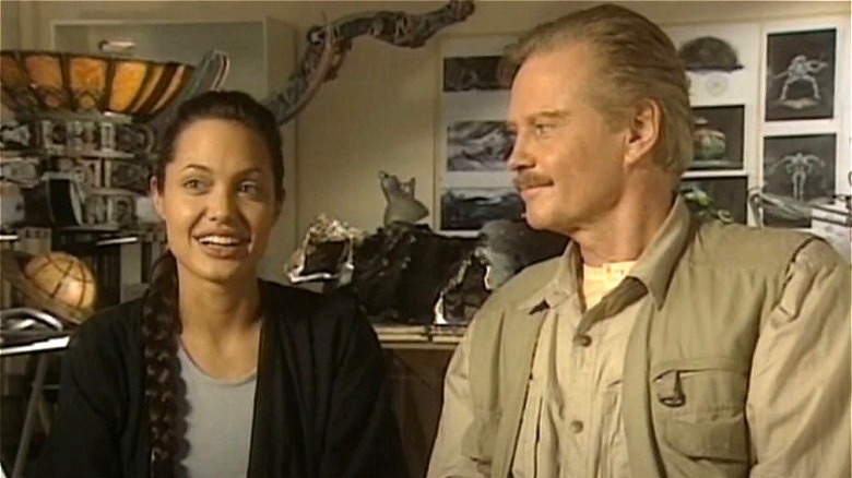 Angelina Jolie and Jon Voight both smiling in interview