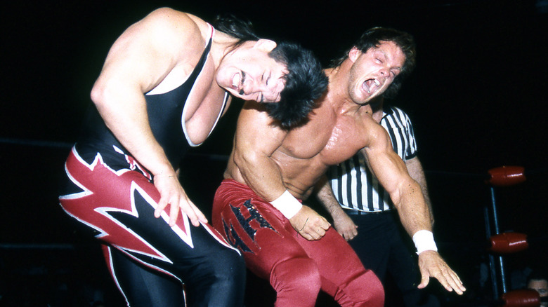 Chris Benoit smacks Eddie Guerrero during a match in 1995