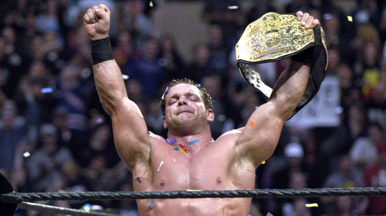 Chris Benoit wins a Triple Threat match for the world championship