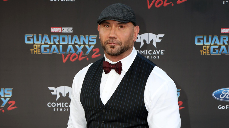 Dave Bautista posing in a hat