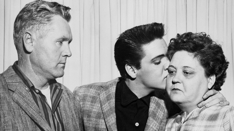 Vernon, Elvis, and Gladys Presley somber