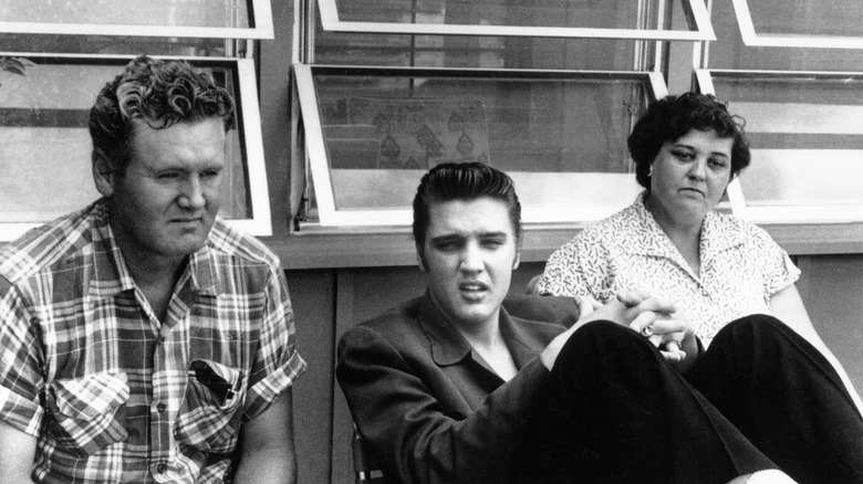 Vernon, Elvis, and Gladys Presley sitting