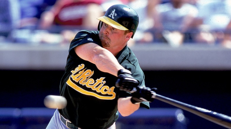 Jeremy Giambi swinging a bat