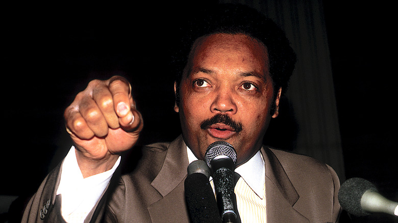 jesse jackson pointing microphone moustache