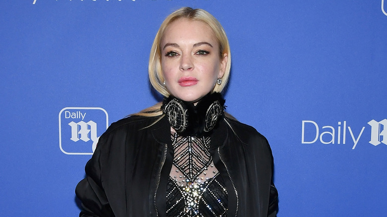 Lindsay Lohan wearing black outfit on red carpet