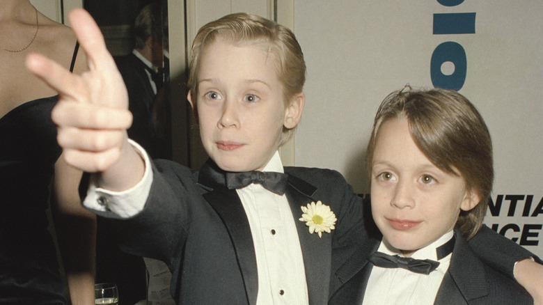 Macaulay Culkin and his brother, posing