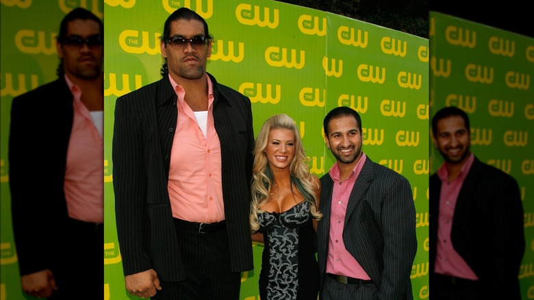 The Great Khali poses with Ashley Massaro and Shawn Daivara