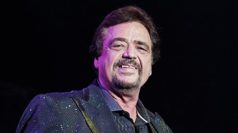 Jay Osmond smiles on stage